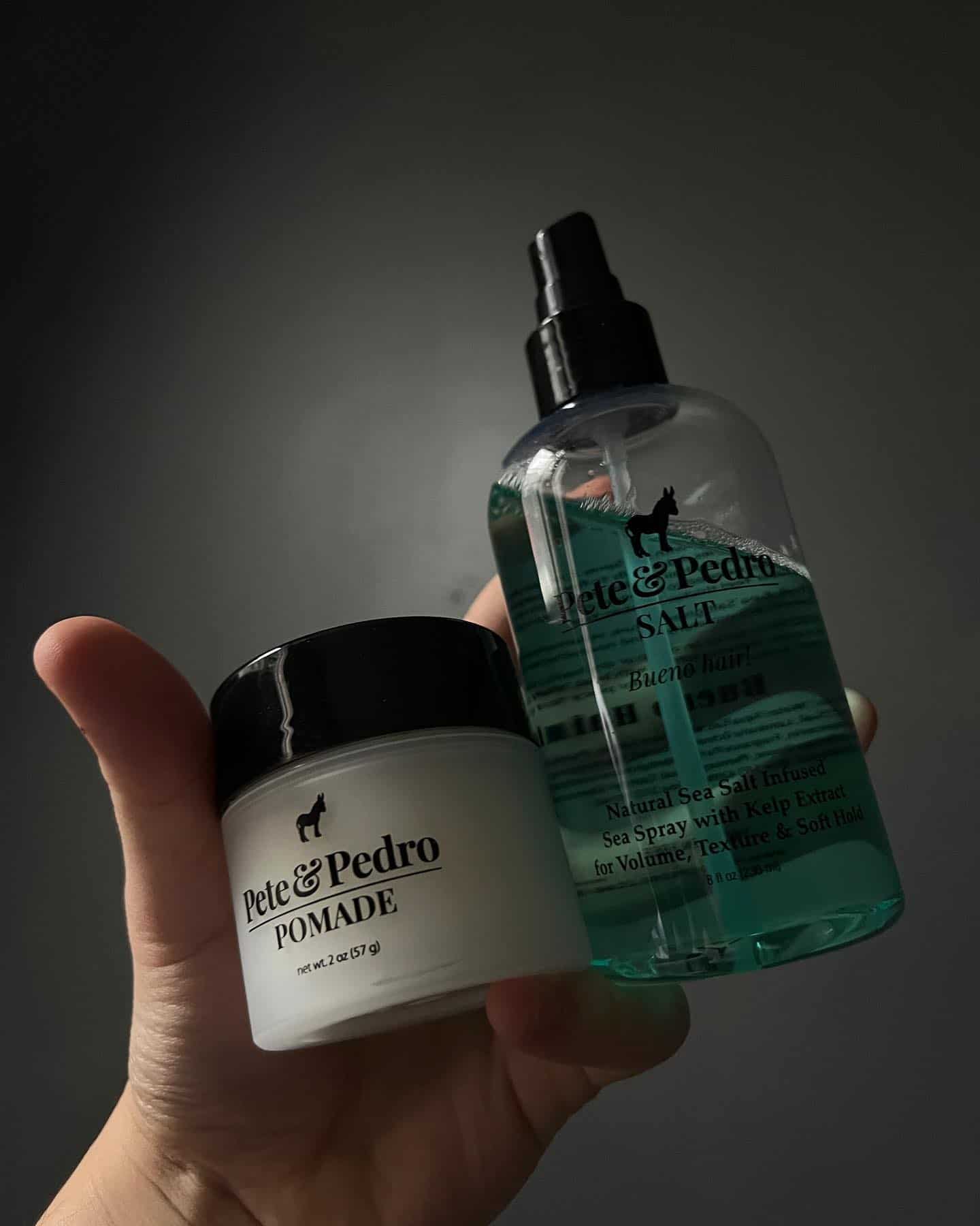 holding a bottle of pete and pedro salt spray and pomade