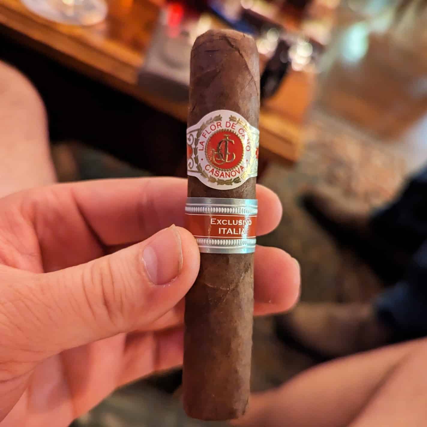 man holding an italian cigar