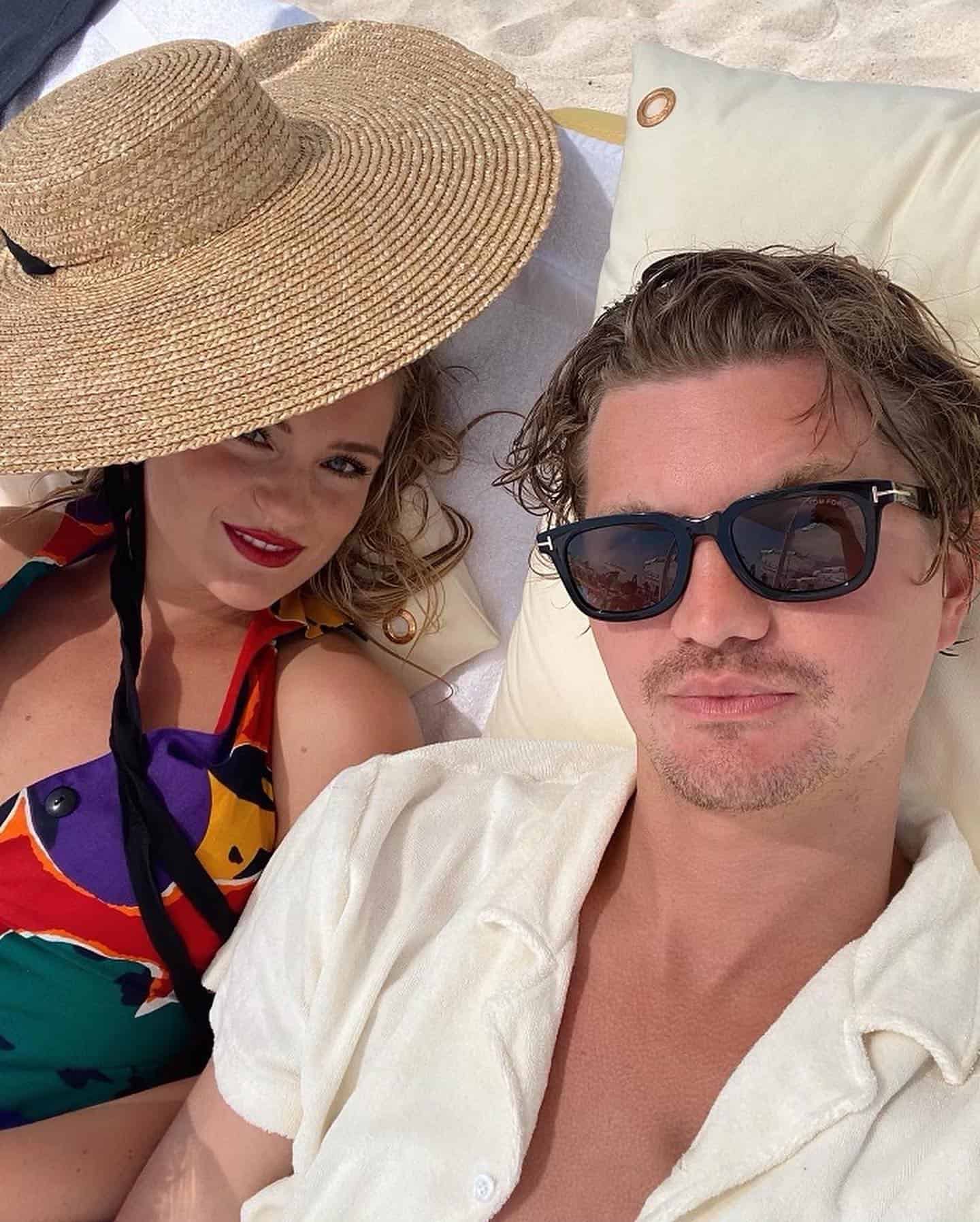 couples taking a selfie at the beach