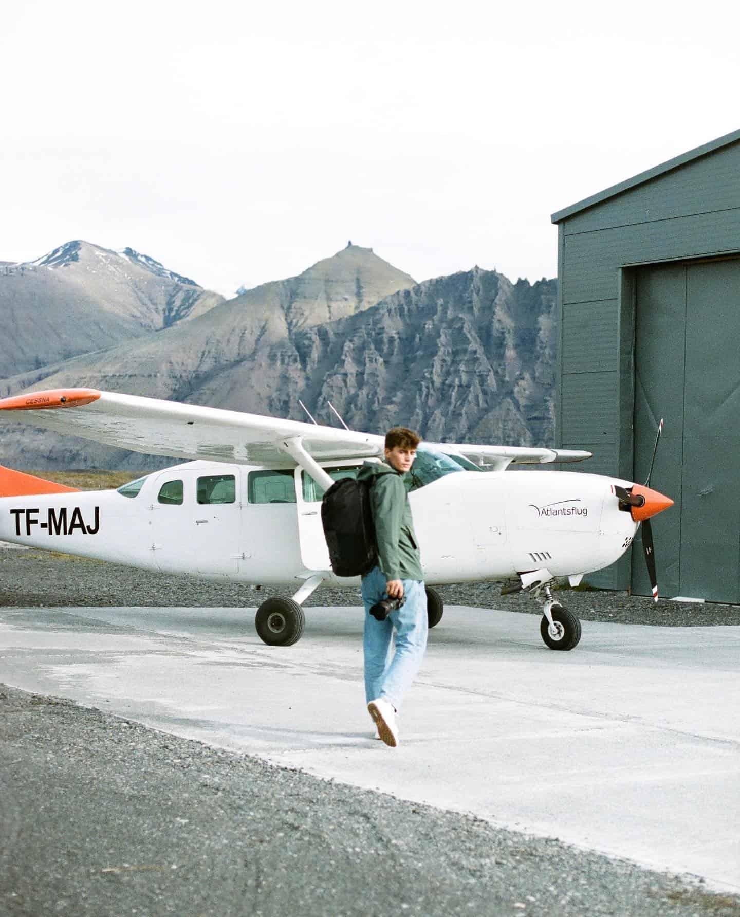 man walking towards a plane