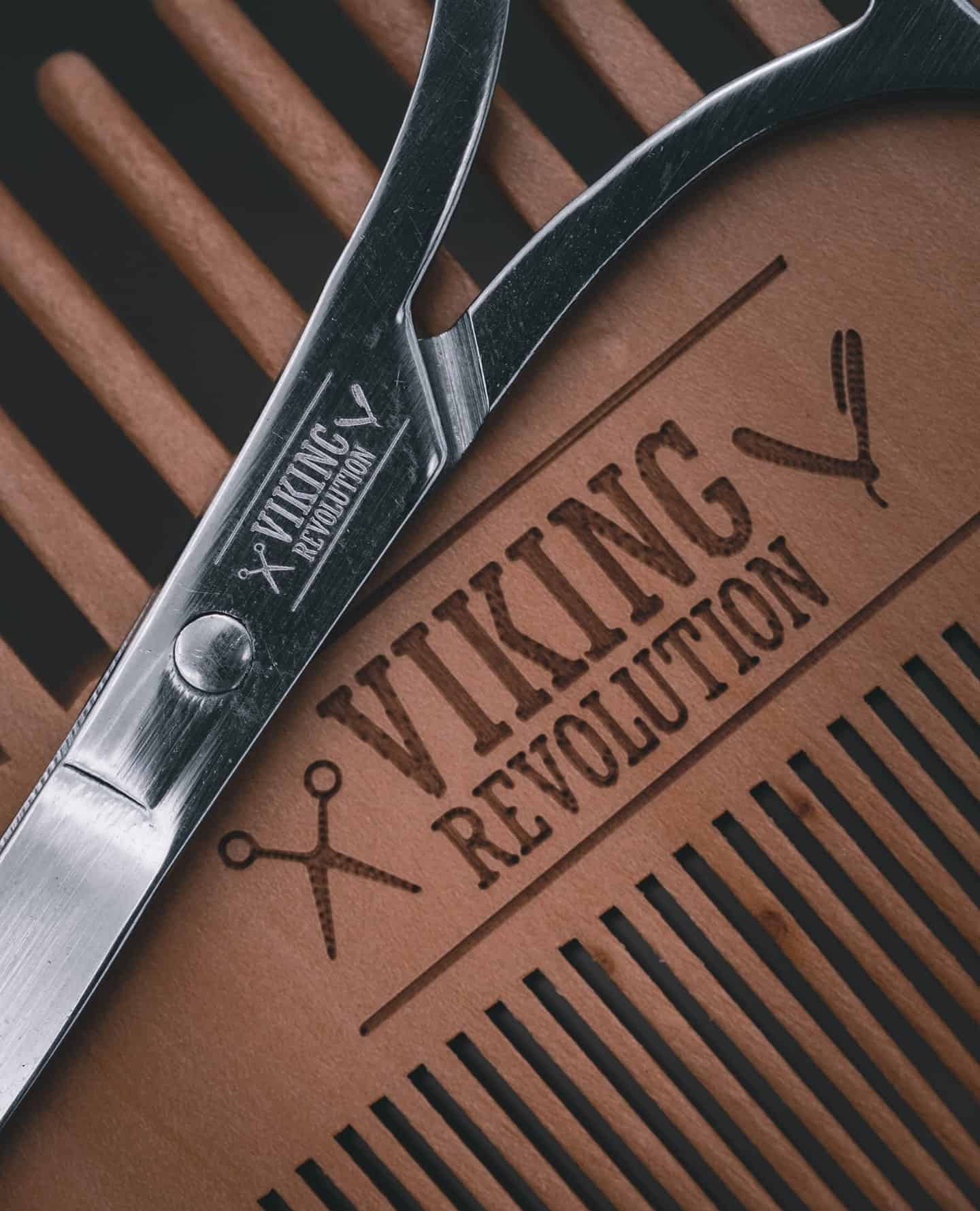 a pair of scissors and mustache comb by viking revolution