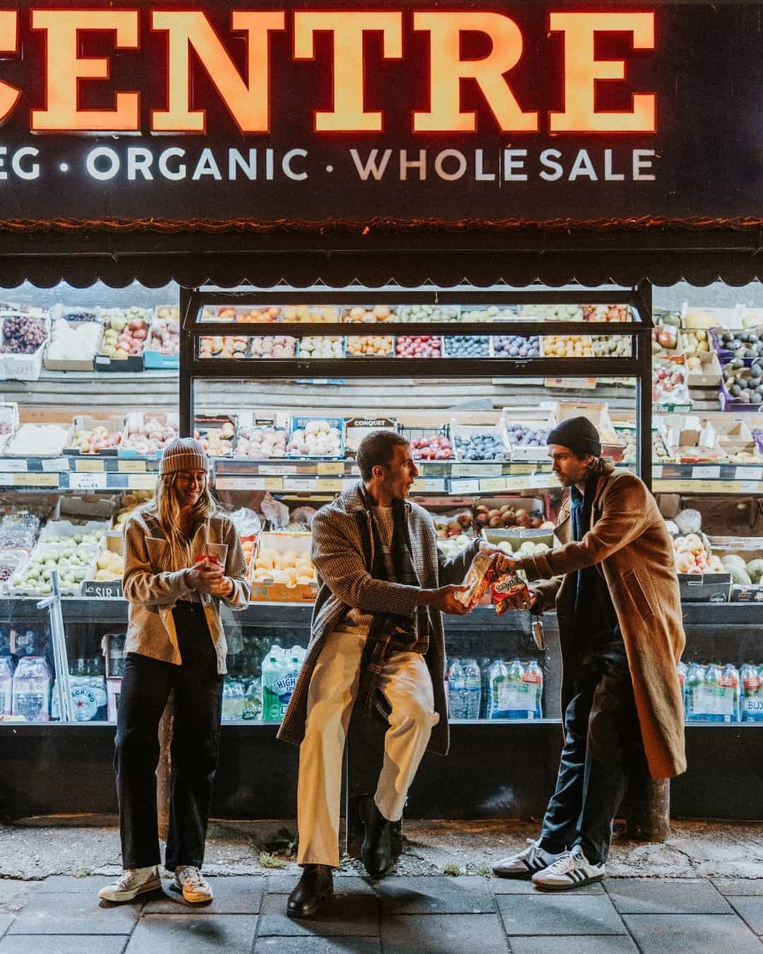 sharing food with friends outside a store
