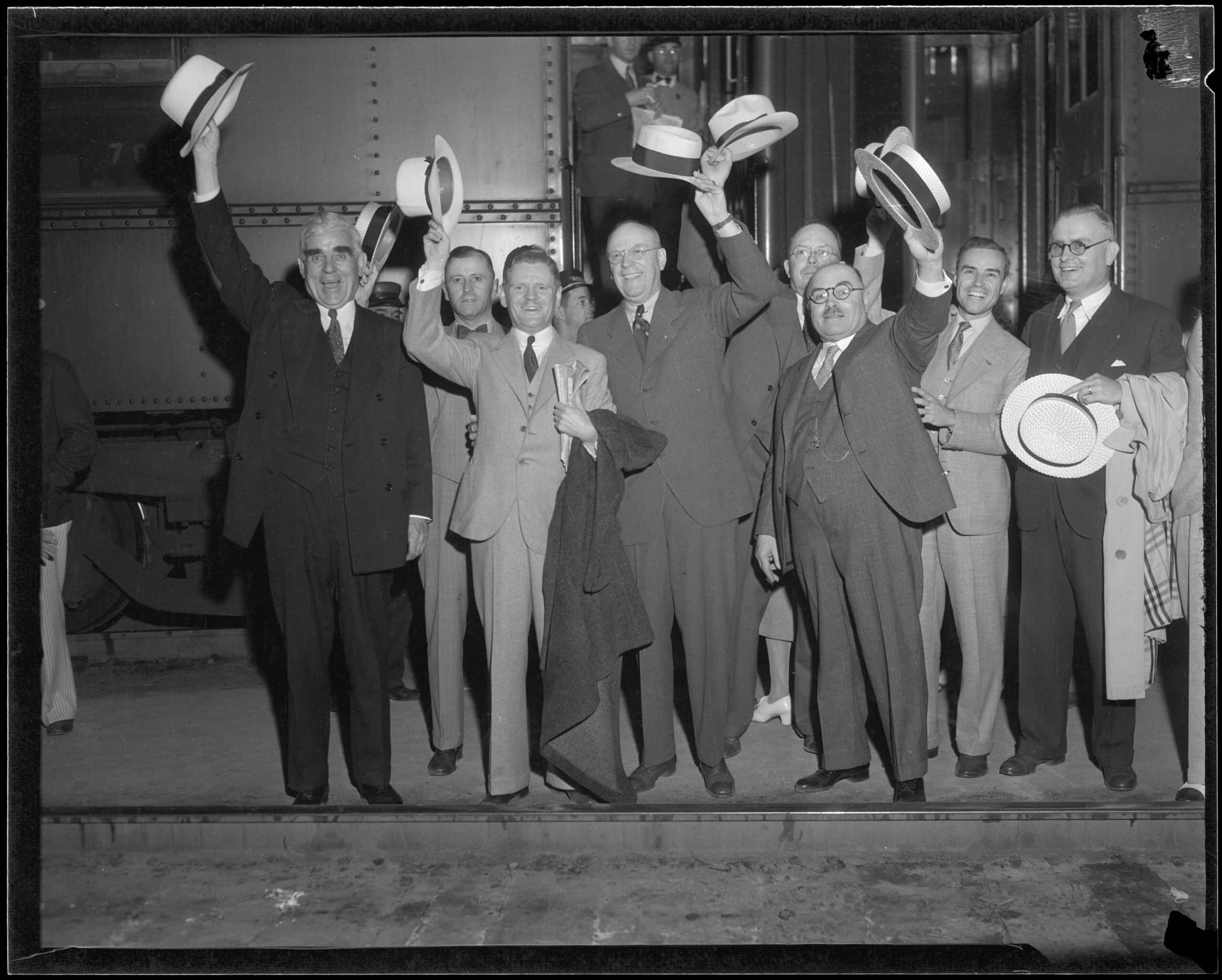 Joseph Scott with a group of men at a train station, Los Angeles, 1930s