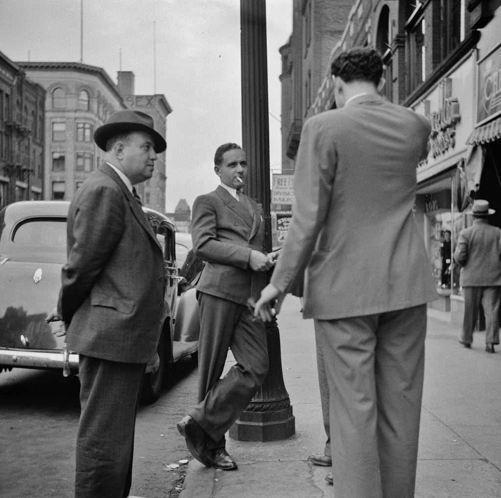 Men talk in a Street scene. Holyoke, Massachusetts, September 1941