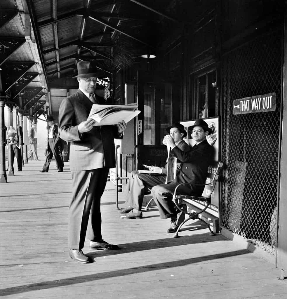 That Way Out: Men waiting for the Third Avenue elevated train in the Fifties at 8:30 a.m., New York, New York. September 1942