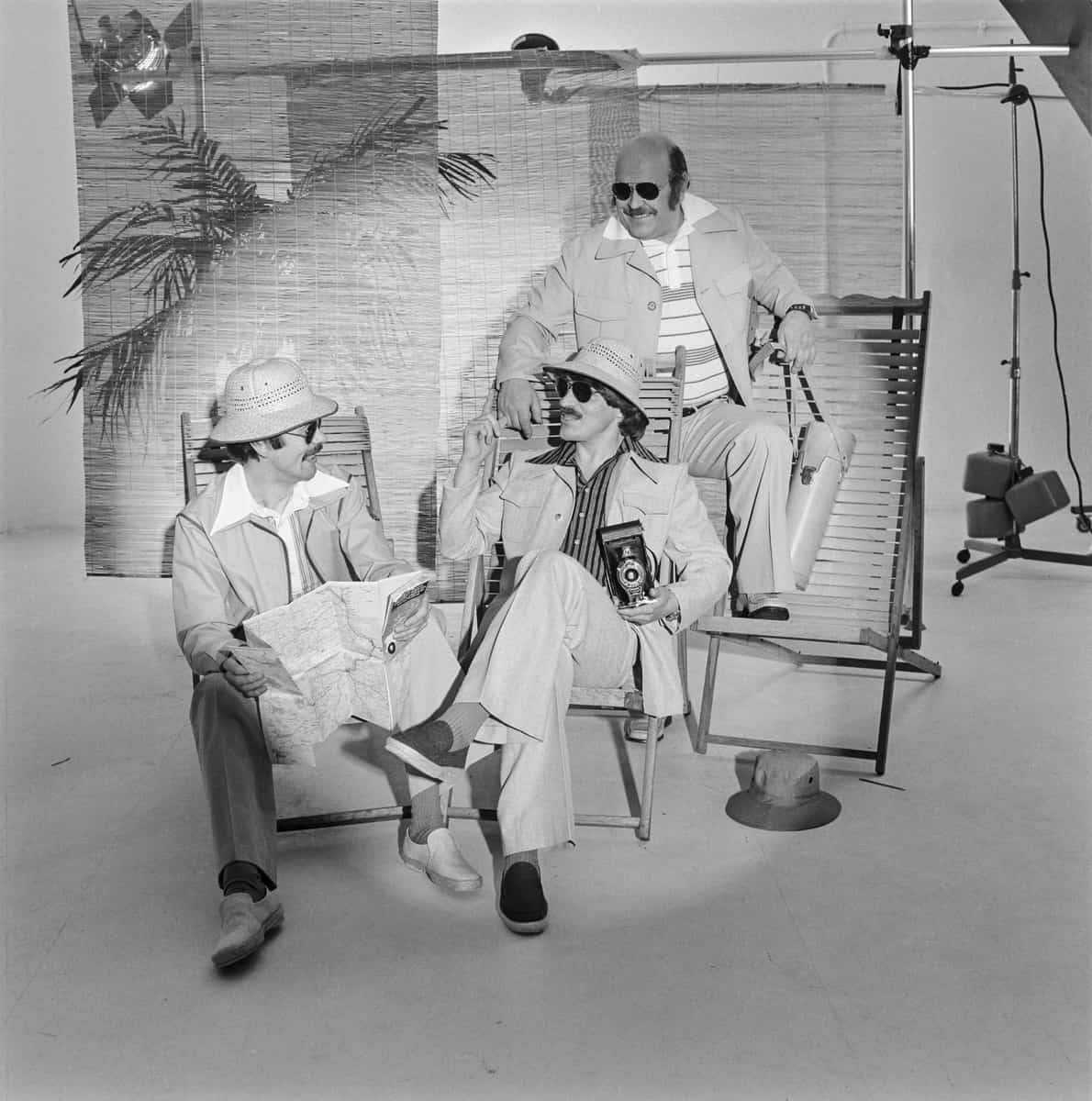 Three men in safari outfits