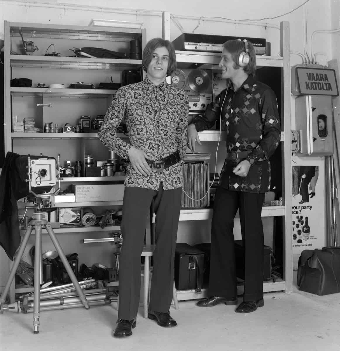 Two men in 1970s listening to music
