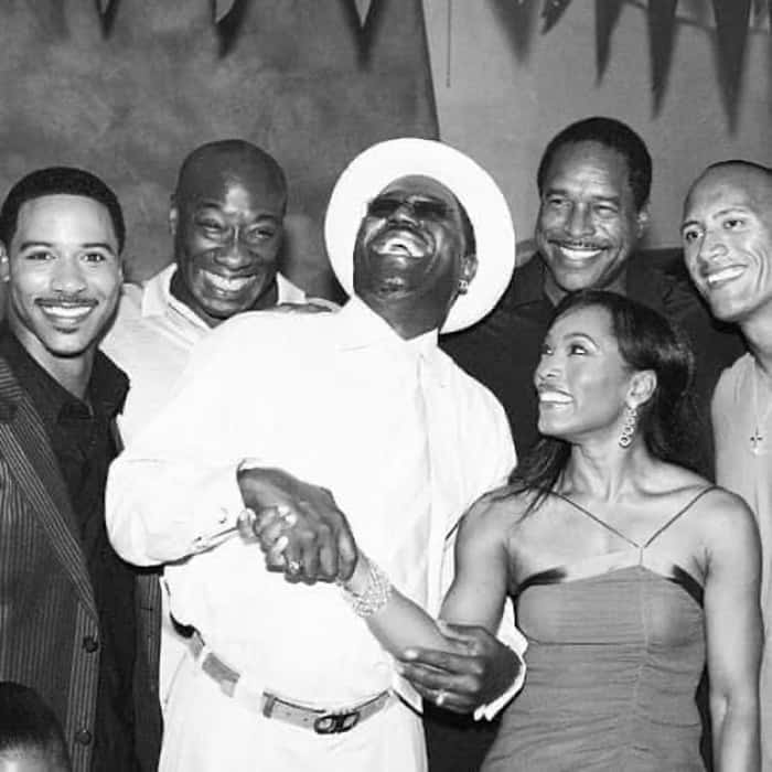 Angela Bassett surrounded by a bunch of talented Black Men
