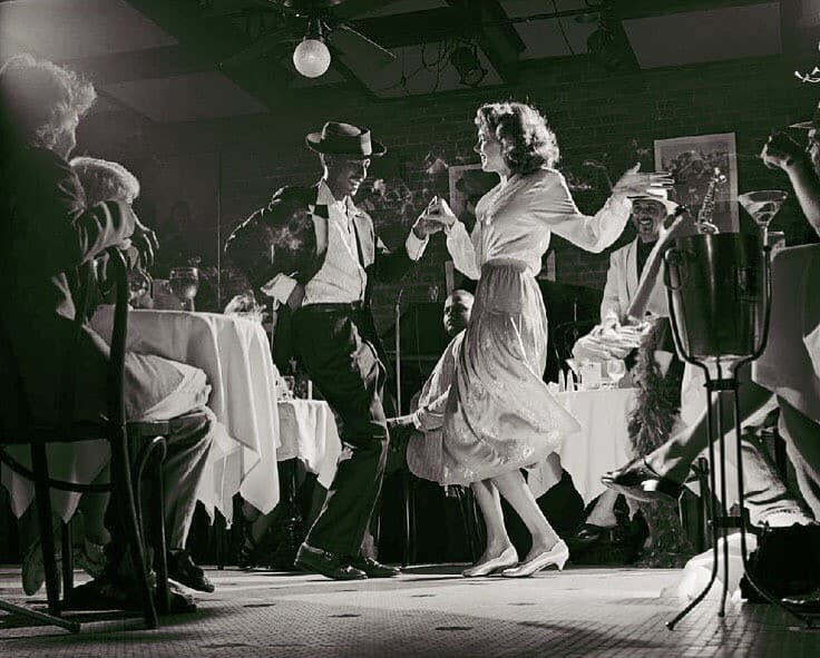 couples in 1940s dancing in a new orleans jazz club