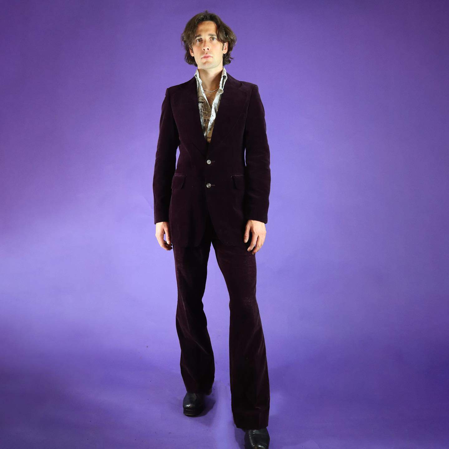 man wearing a 1970s inspired velvet suit
