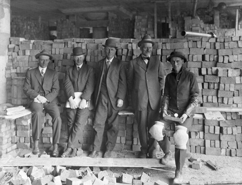 Men with bricks, 1915" by Seattle Municipal Archives is licensed under CC BY 2.0.