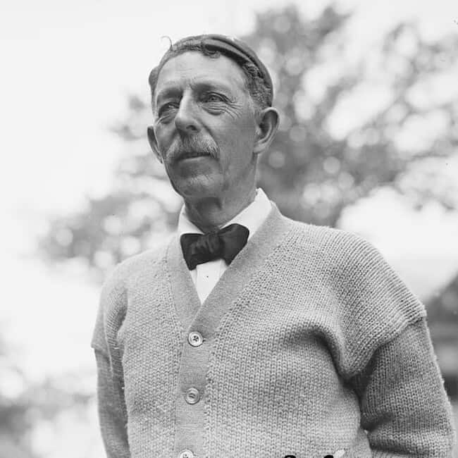 man in 1910 wearing a knitted cardigan