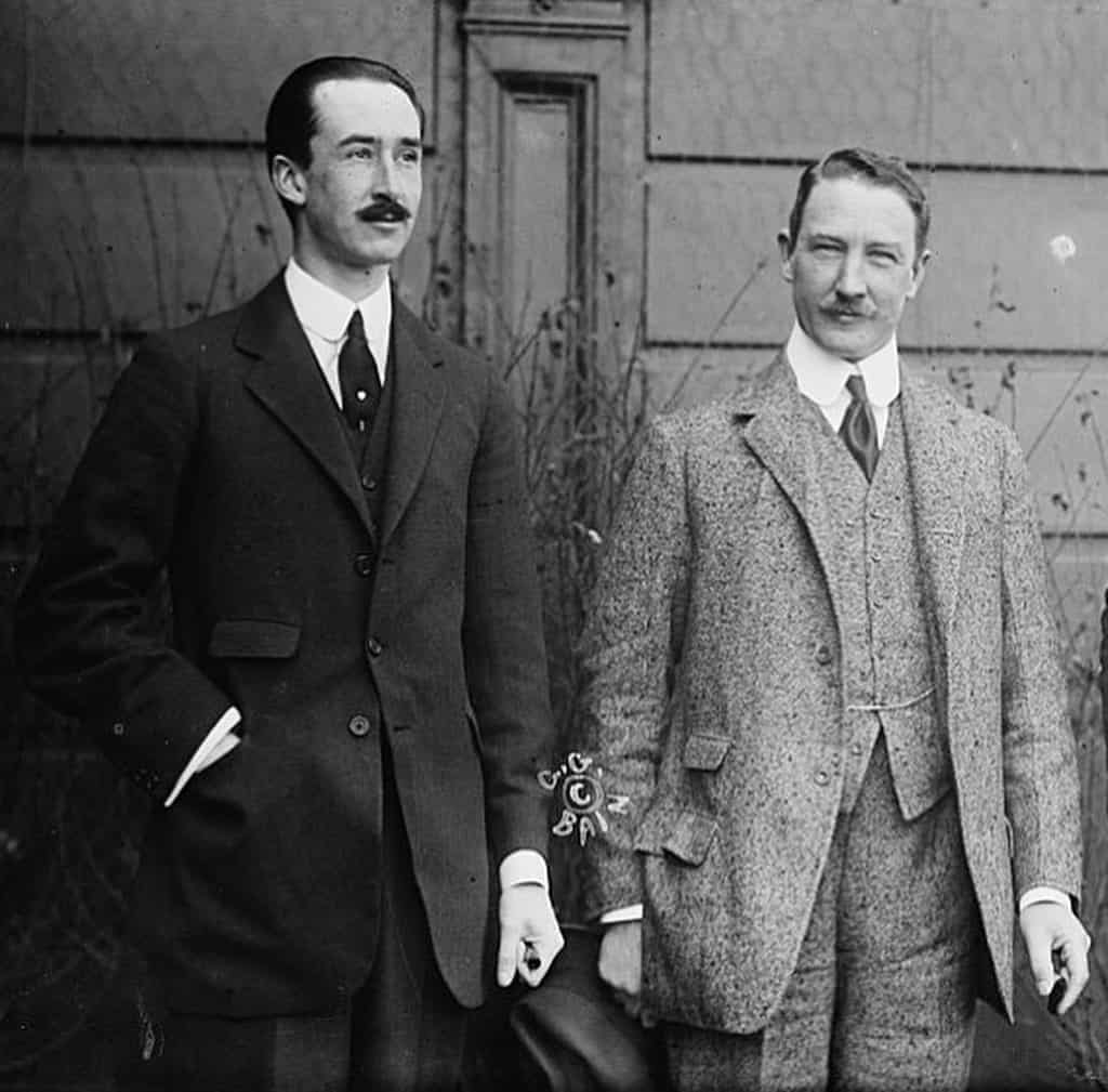 two men in a three piece suit in 1910