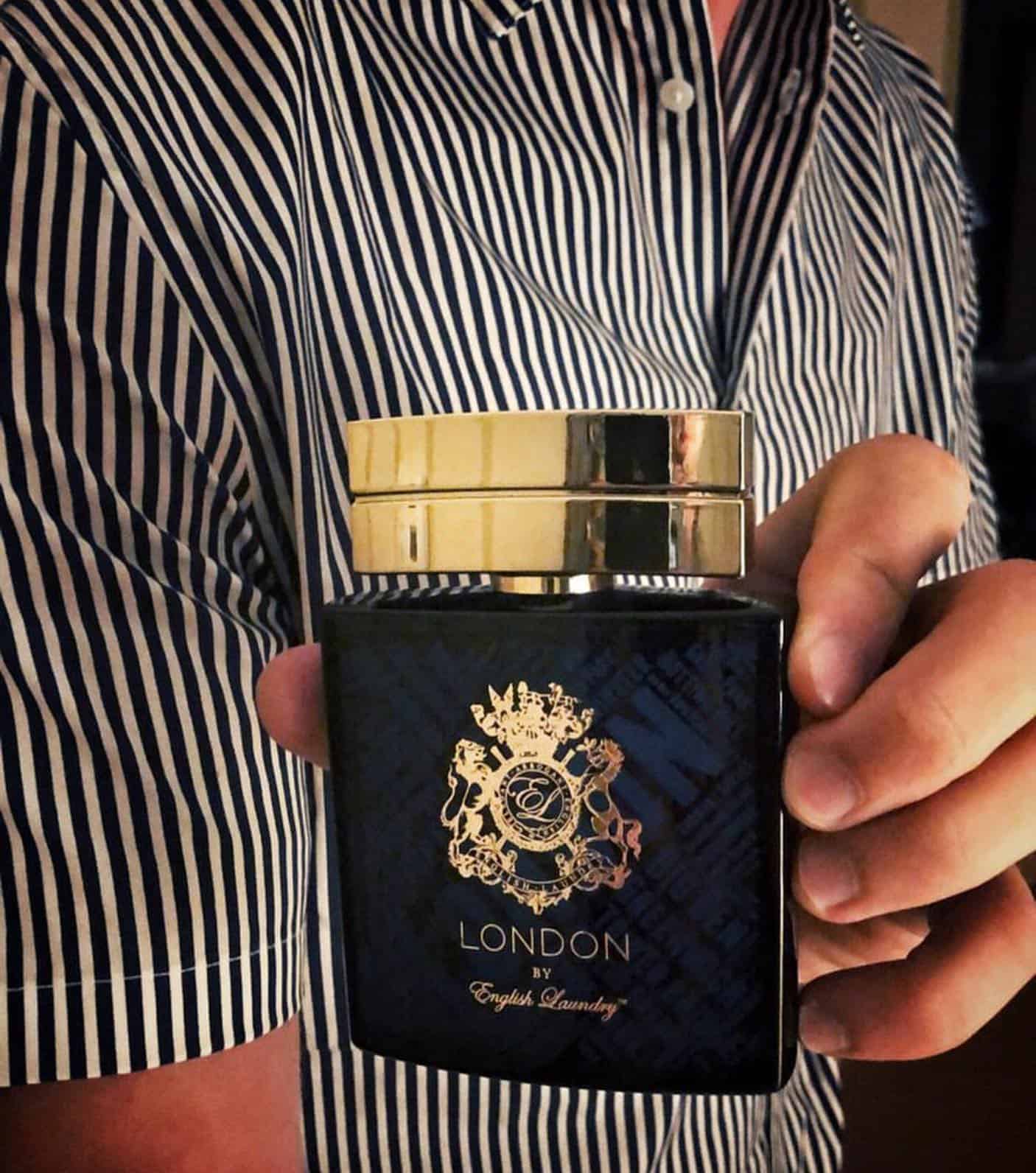 holding a bottle of london cologne by english laundry