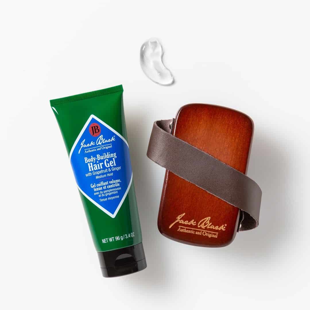 a tube of body building hair gel and military palm brush by jack black