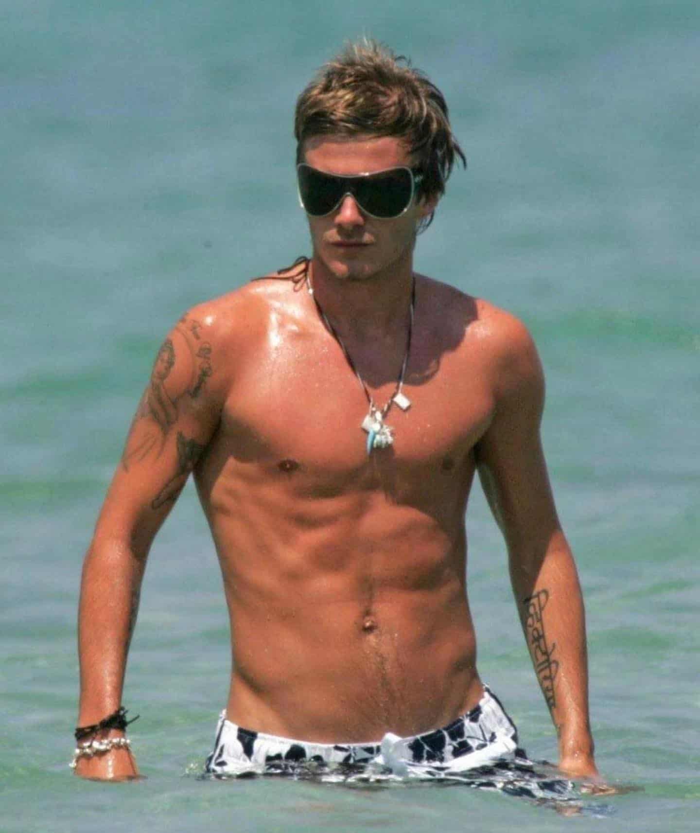 david beckham at the beach wearing shorts and sunglasses 2005