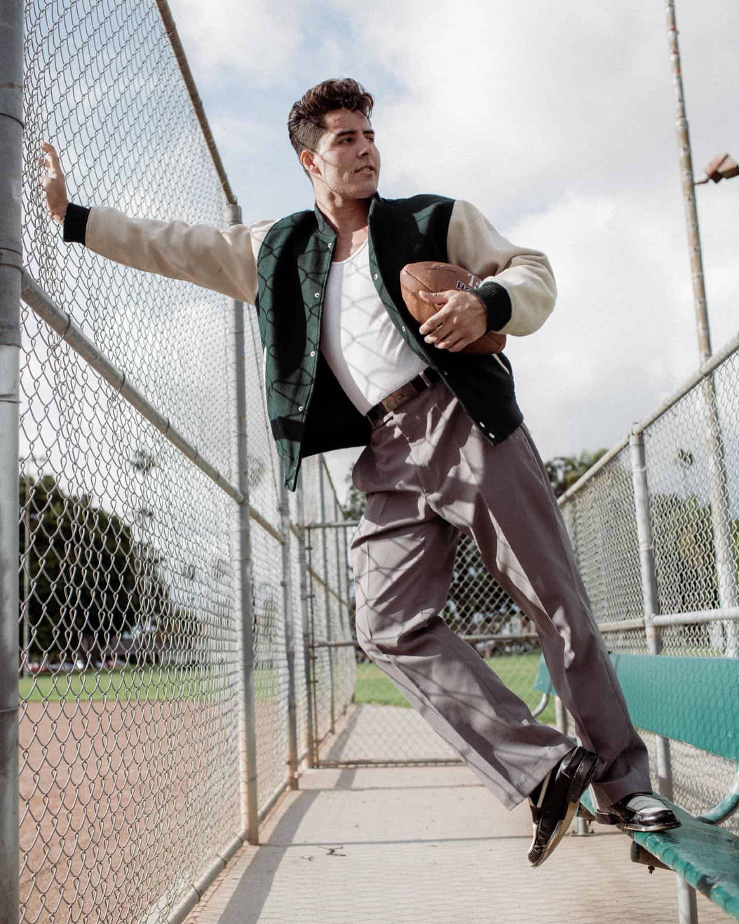 man in 1959 wearing a varsity bomber jacket
