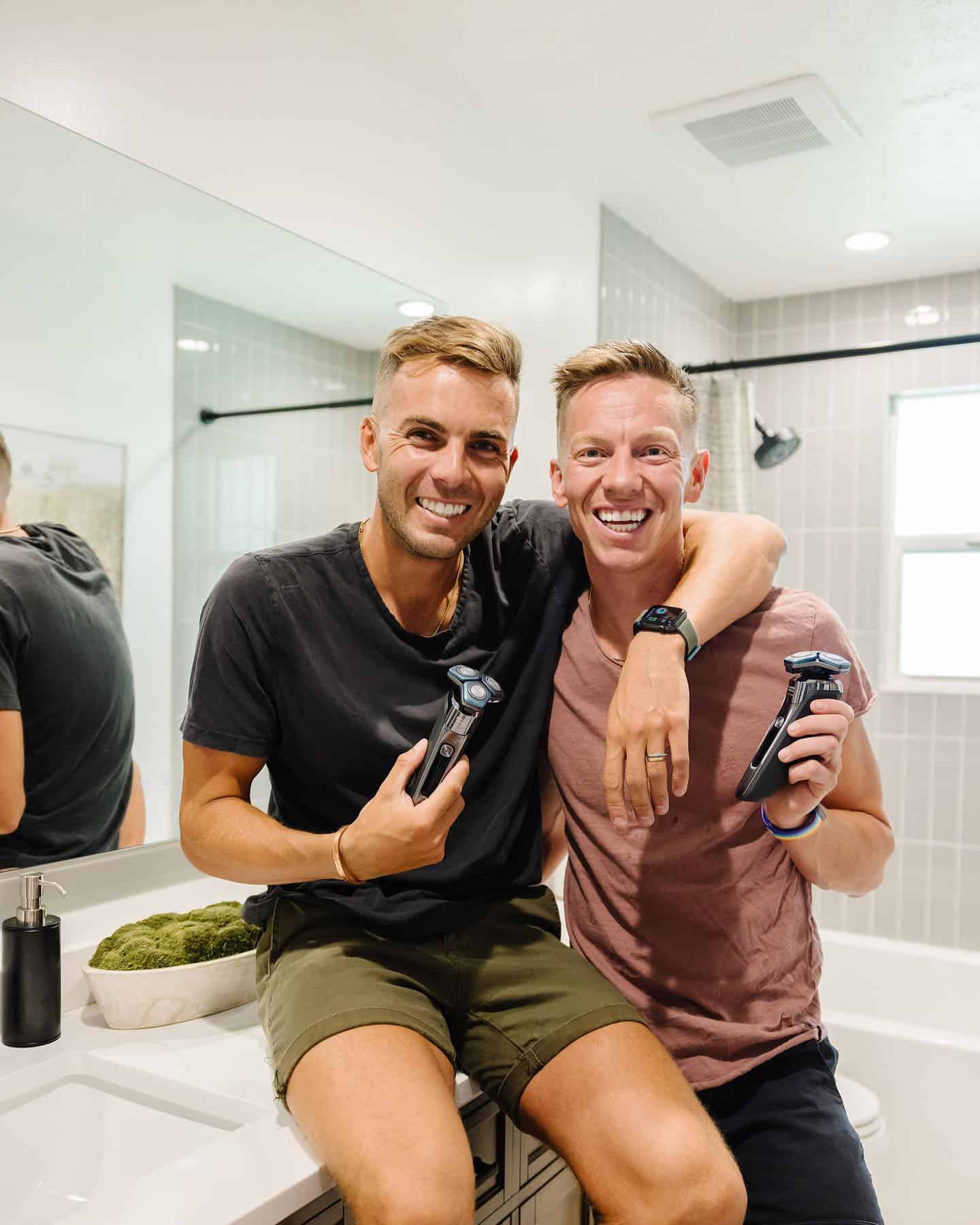 two men holding the philips norelco 7000 electric shaver