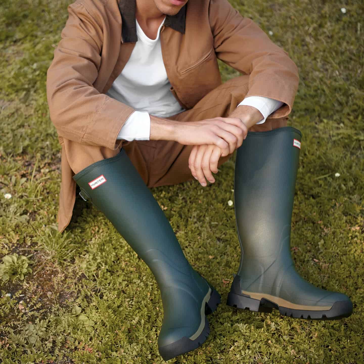 wearing a pair of rain boots by hunter