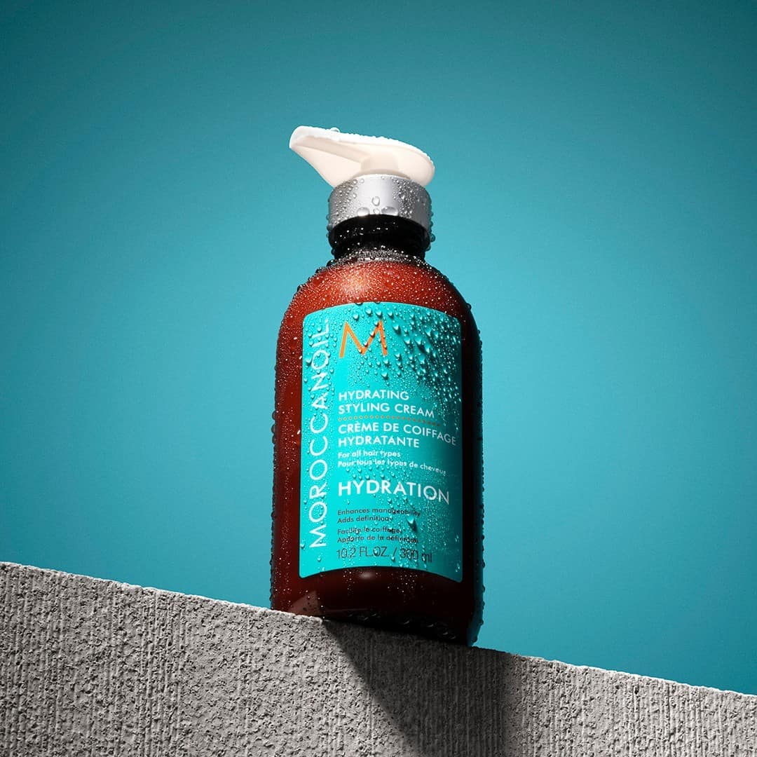a bottle of moroccanoil hydrating styling cream