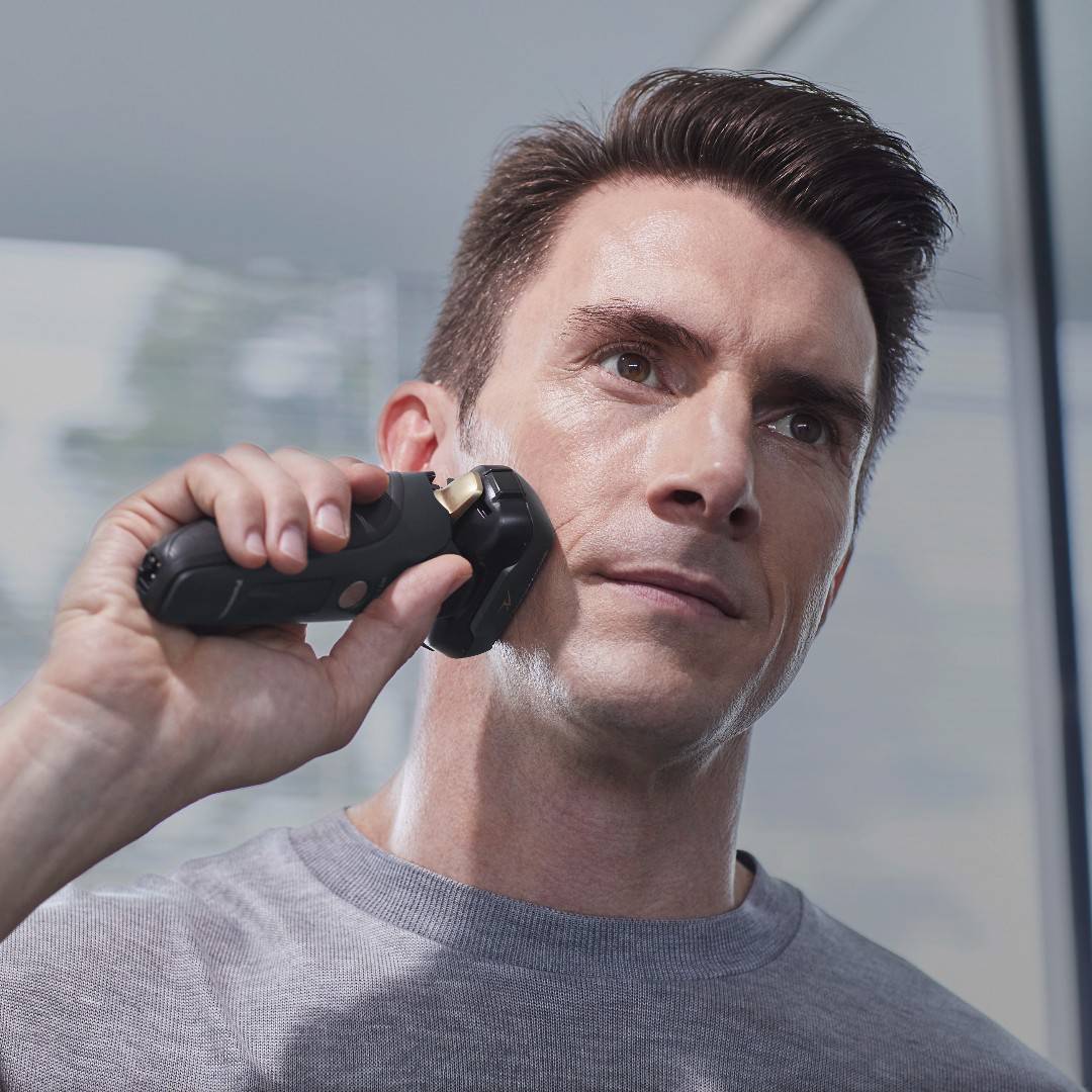man using the panasonic lv97 electric shaver