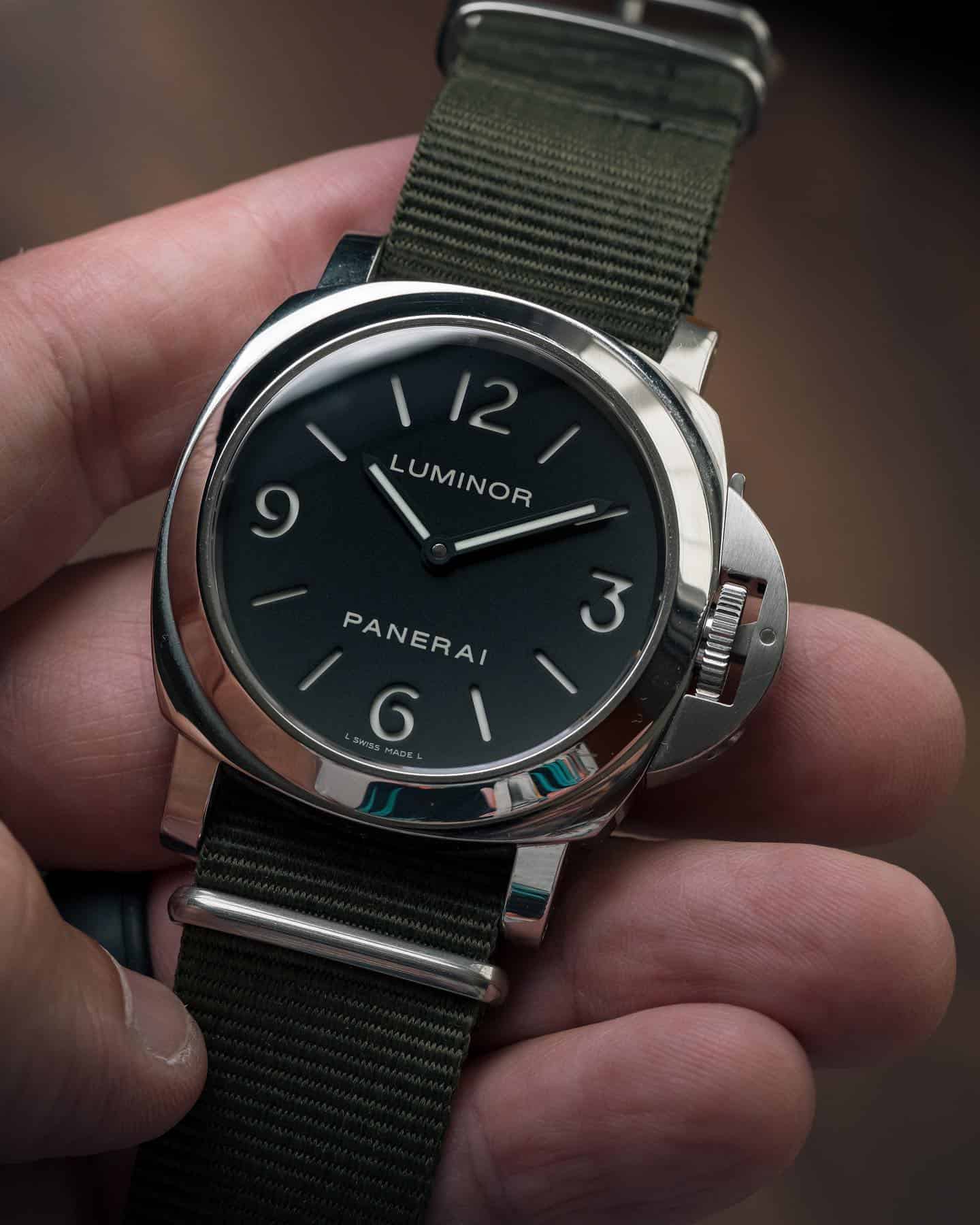 holding a luminor panerai in a nato strap by ritche watch bands