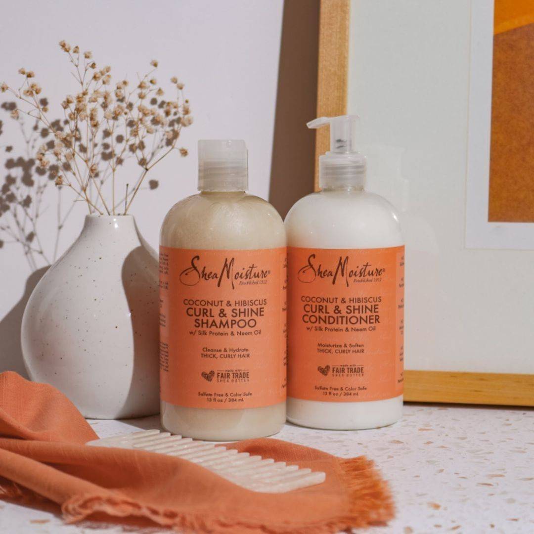 a bottle of shea moisture curl and shine shampoo and conditioner