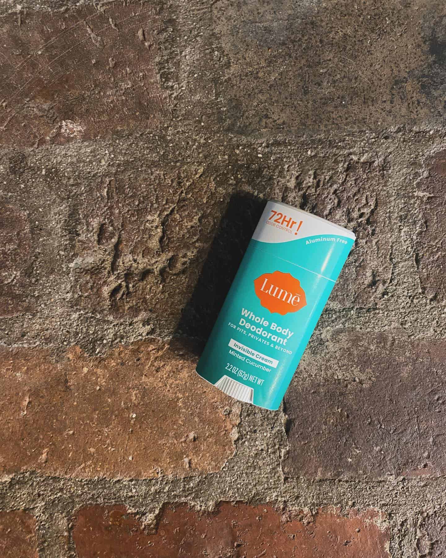 the lume whole body deodorant laying on the ground