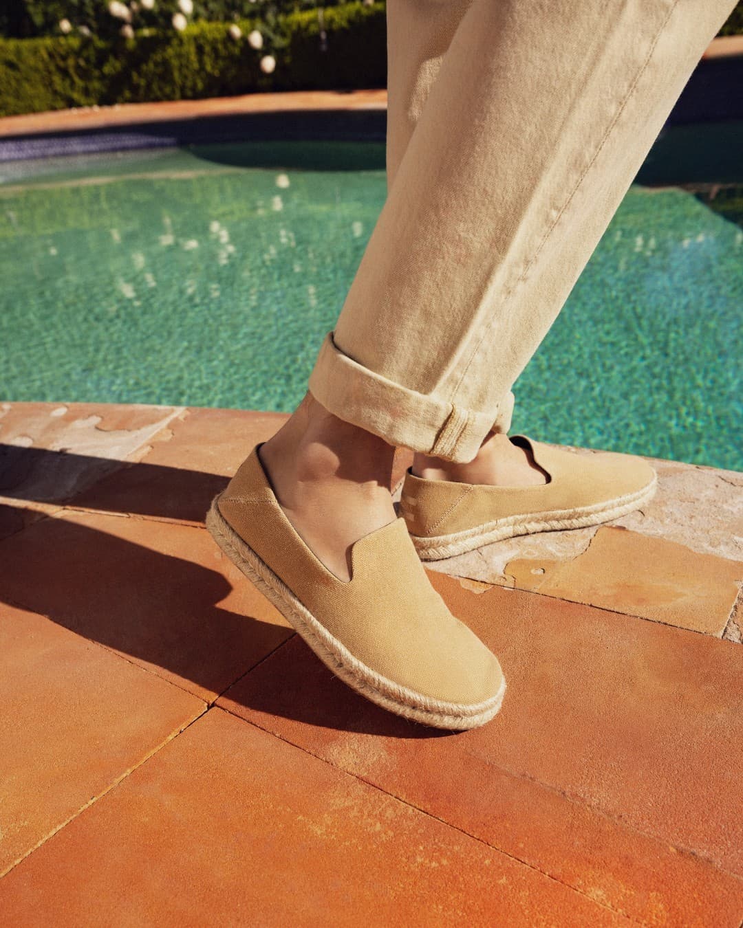 wearing a pair of espadrilles by toms