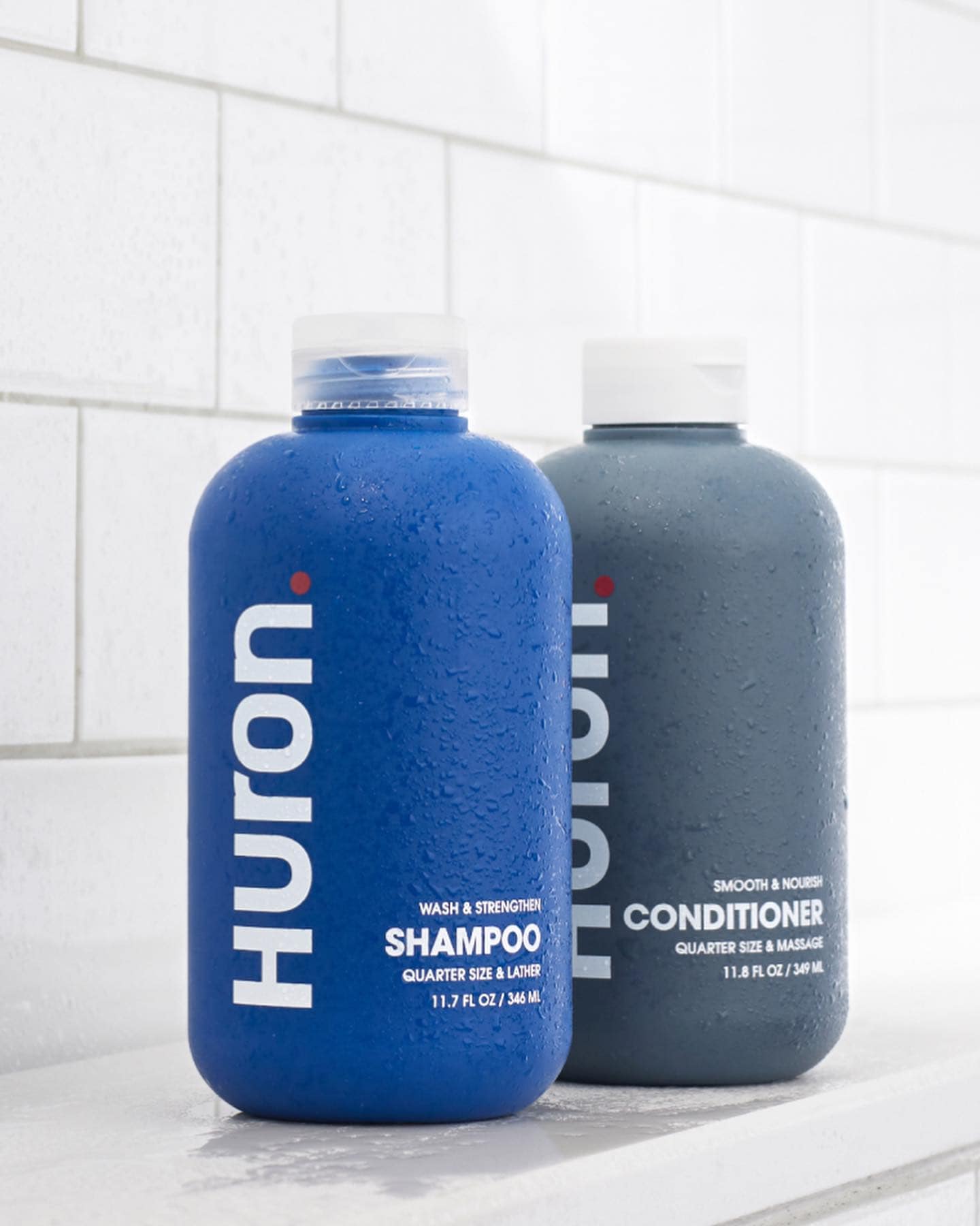 a pair of shampoo and conditioner by huron