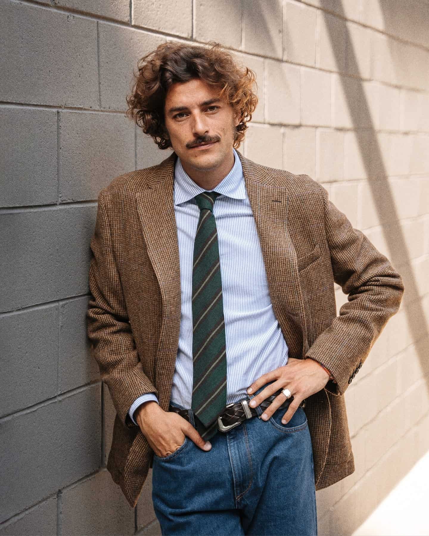 man wearing a brown classic italian style blazer by velasca