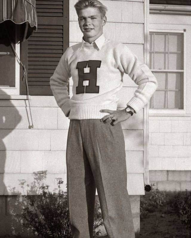 man in 1950s wearing a sweater over a shirt