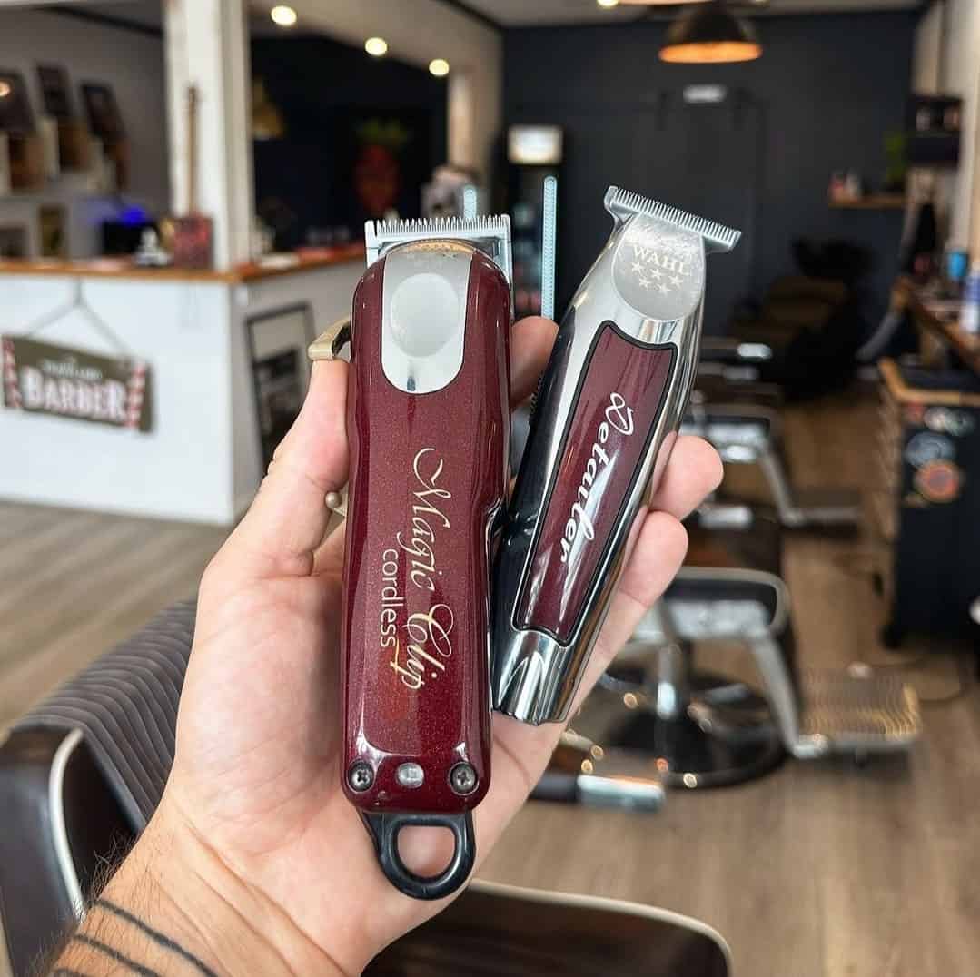holding a cordless magic clip and detailer by wahl