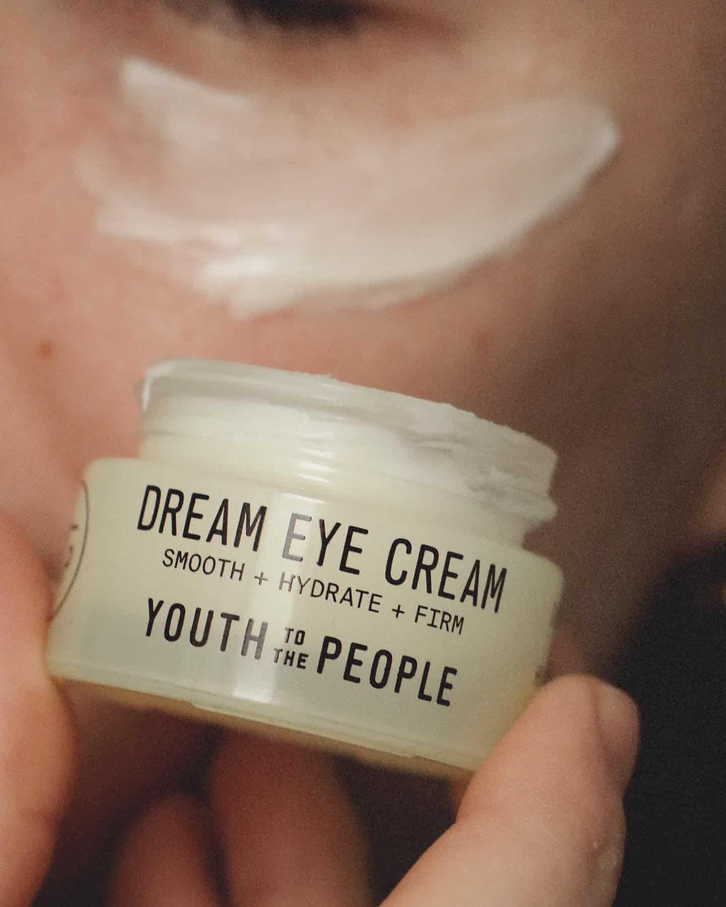 applying the dream eye cream by youth to the people