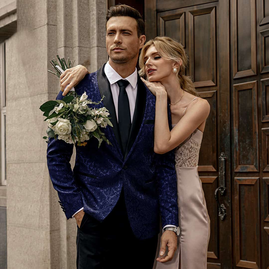 woman with flowers and arm over a man's shoulder