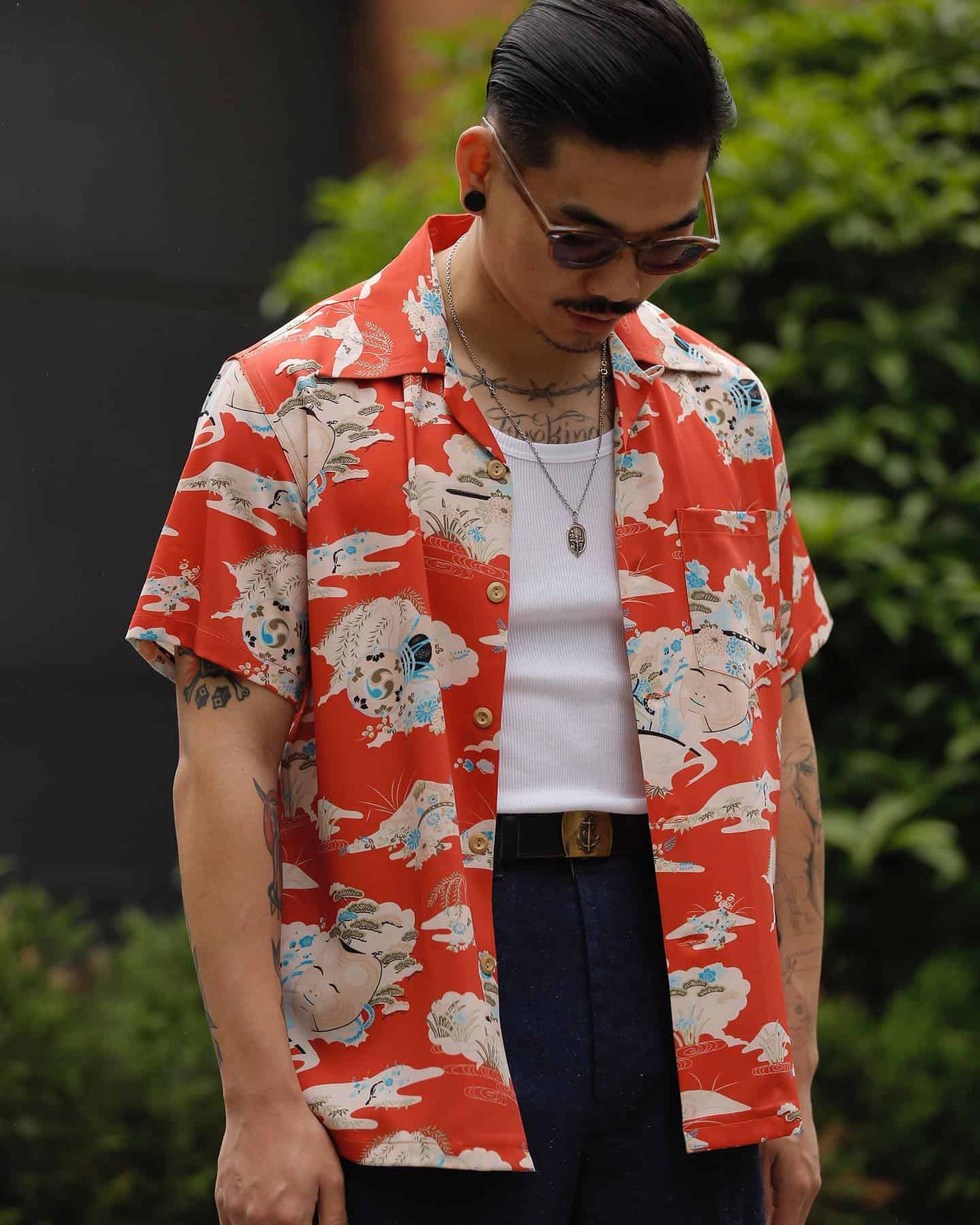 man wearing an unbuttoned short sleeved shirt