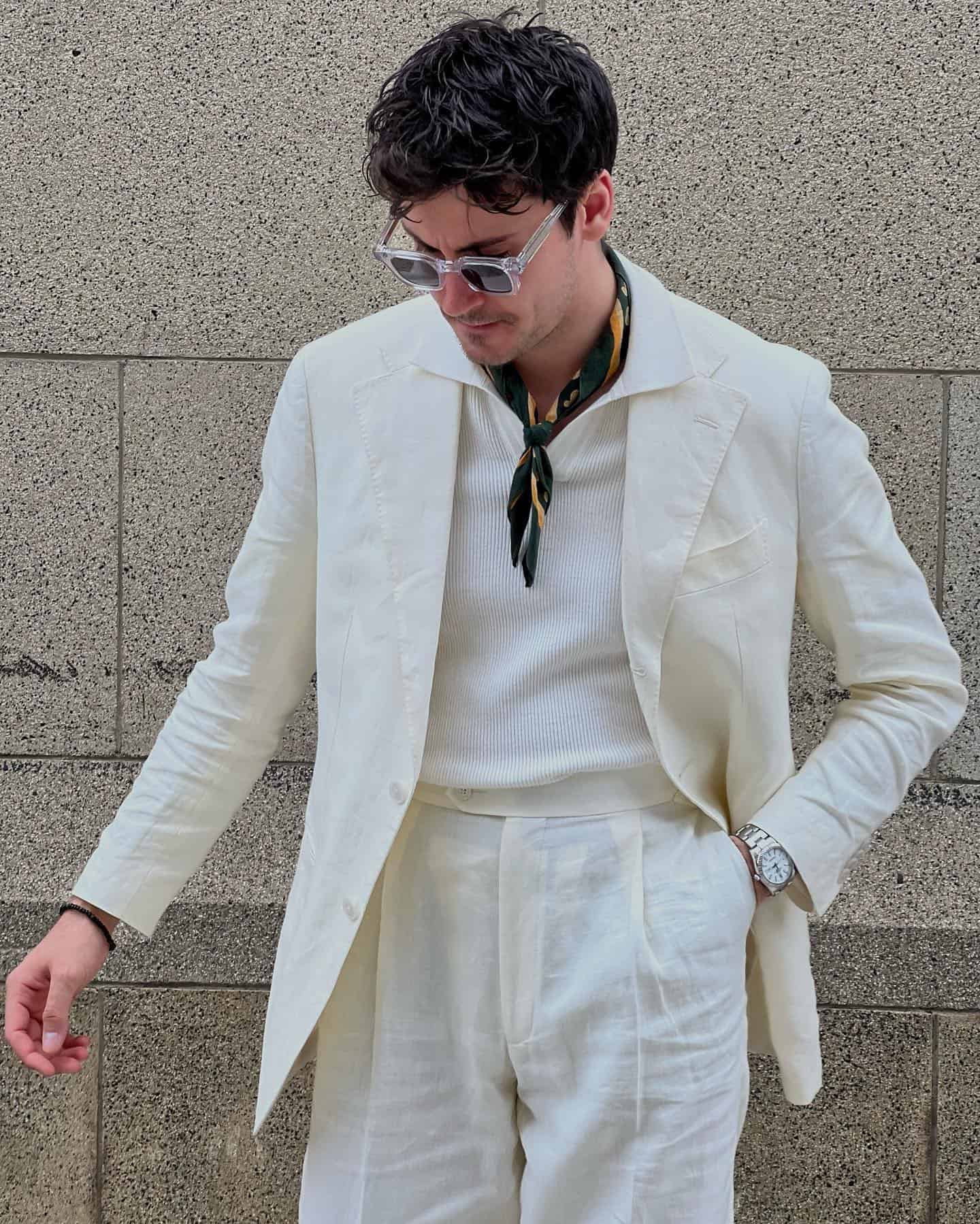 man with sunglasses wearing a suit by suitsupply