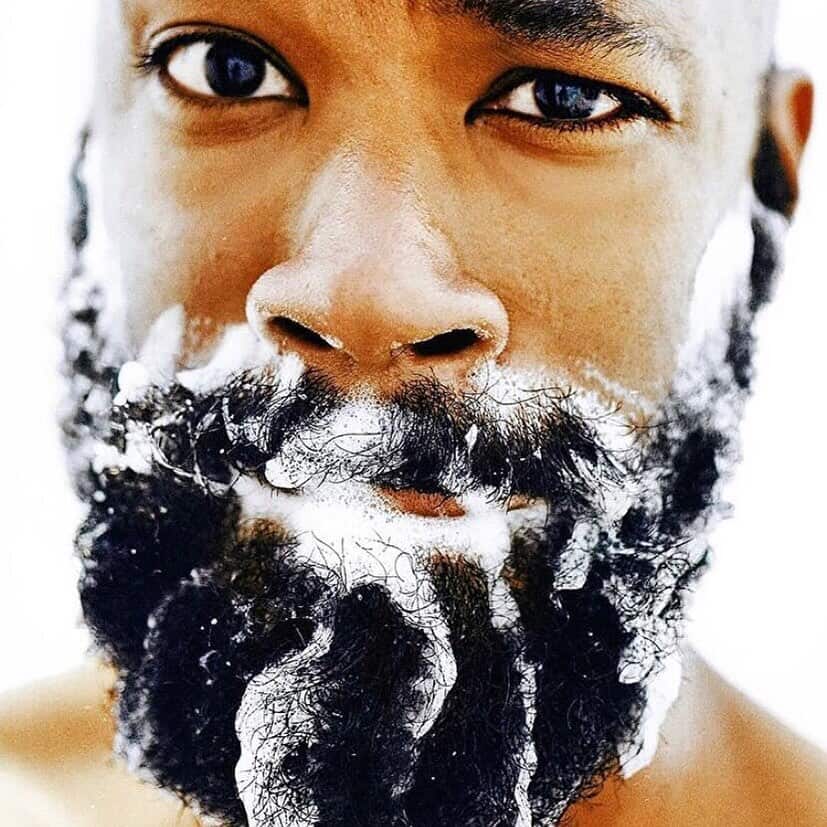 man with beard wash soap on his beard