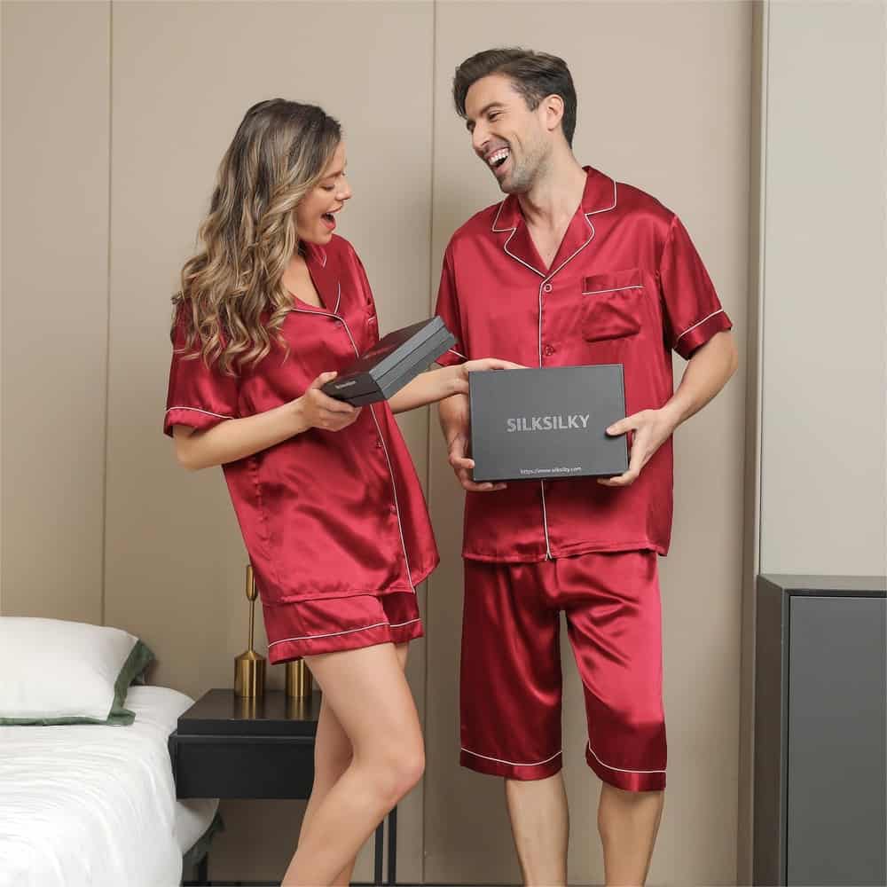 couple exchanging a box of silk silky pajamas