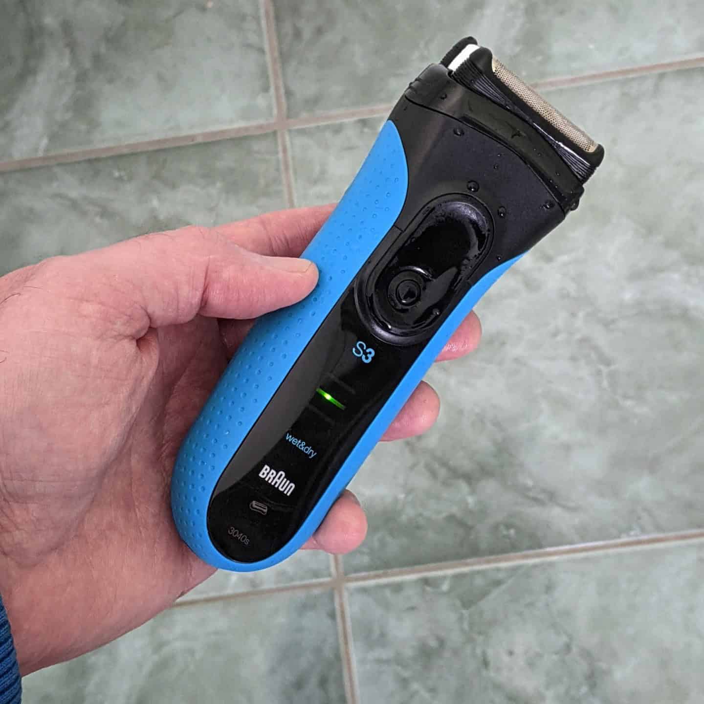 holding a ProSkin series 3 foil shaver by braun