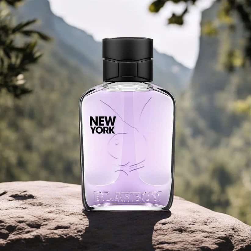 a bottle of new york cologne on a rock by playboy