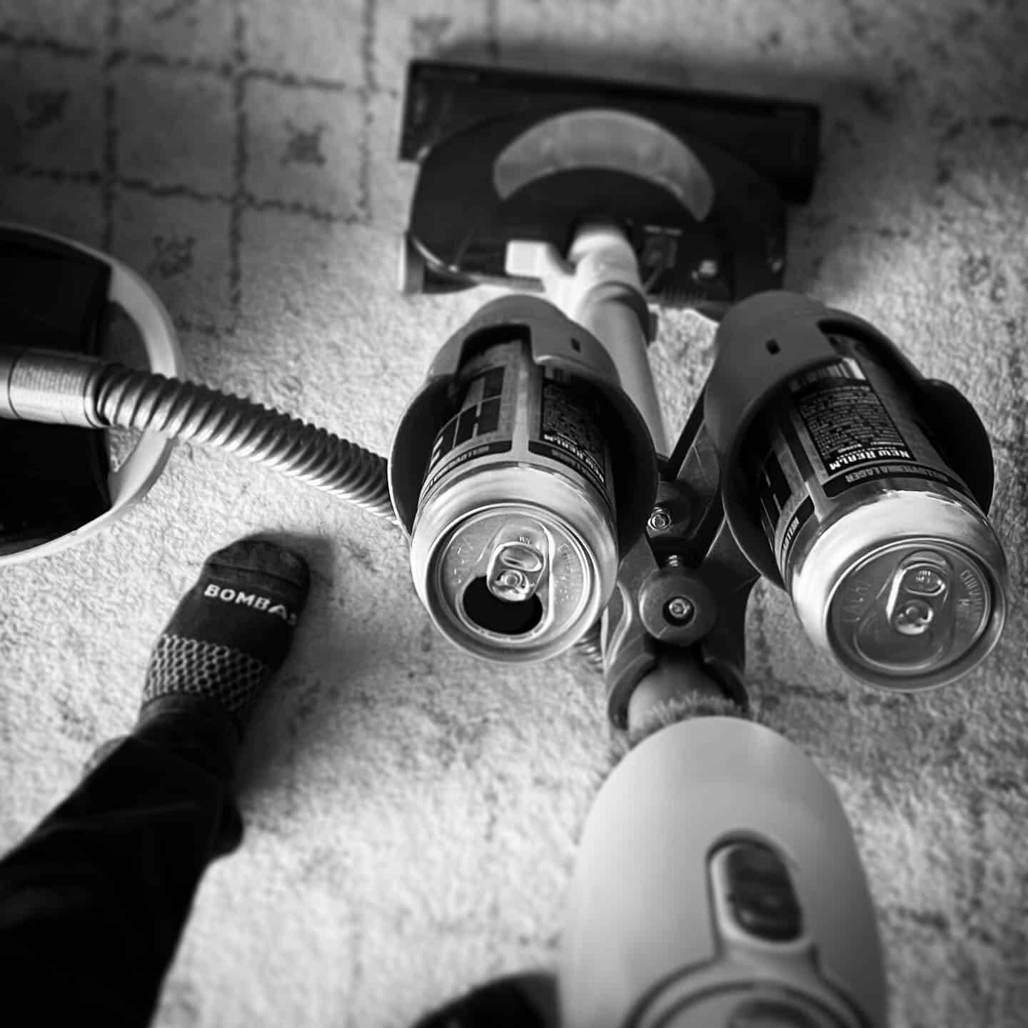 wearing a pair of socks by bombas while vacuuming the carpet