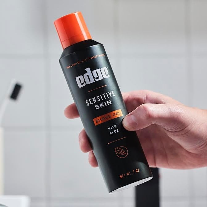 holding a bottle of sensitive skin shave gel by edge