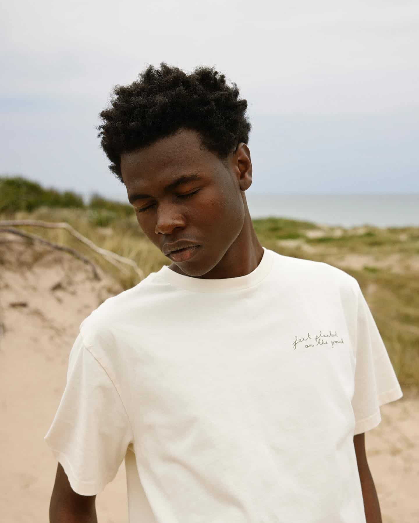 man at the beach with eyes closed