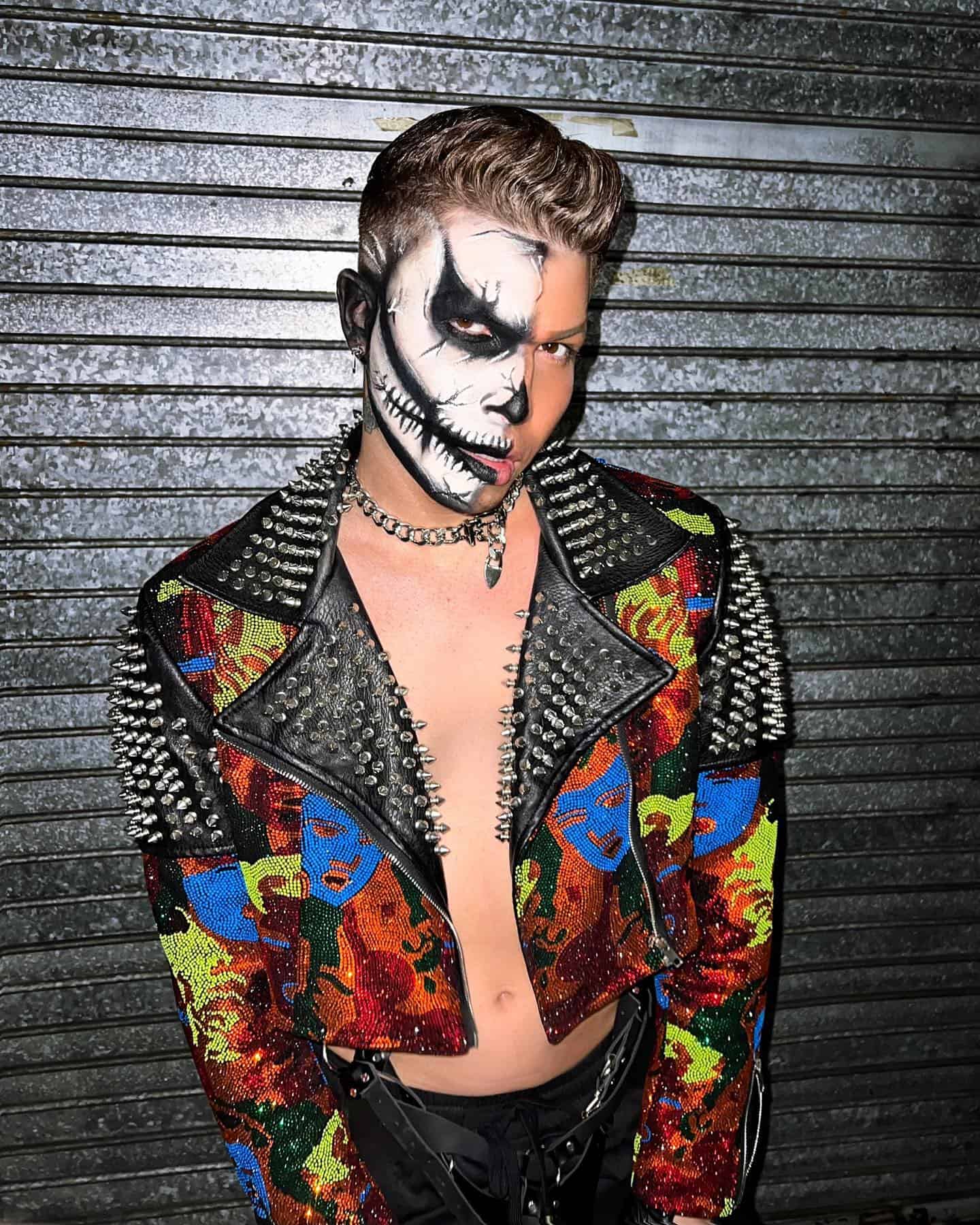 man wearing a leather jacket with print and spikes