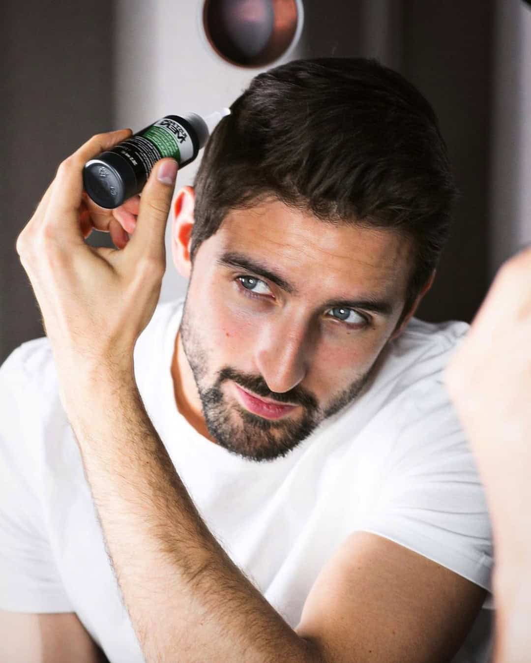 man applying a hair dye by just for men