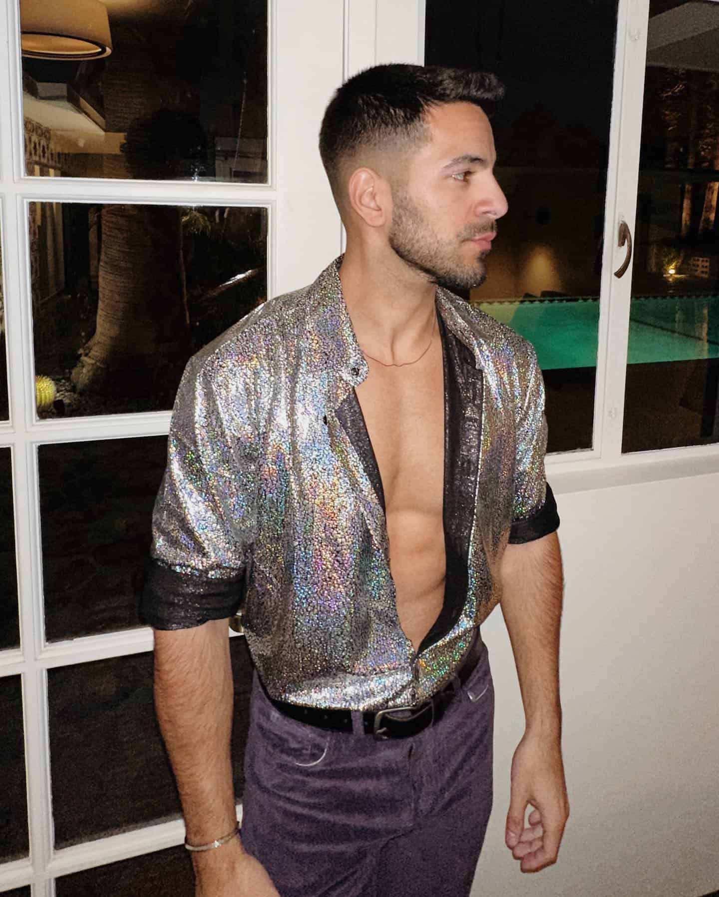 man wearing a shirt with glitters