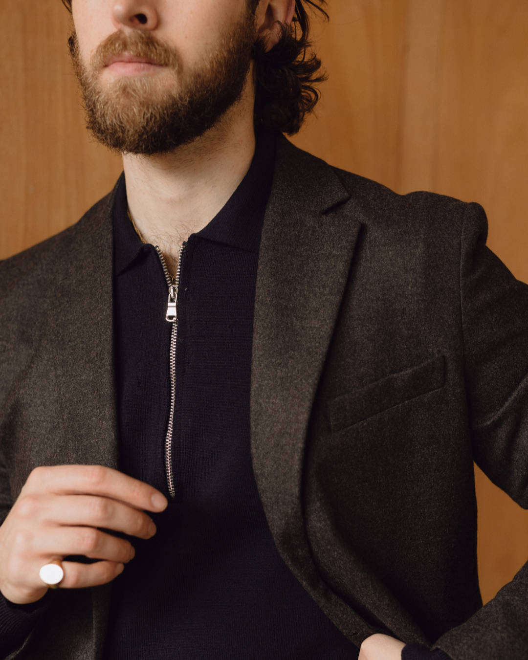 man wearing a dark brown merino wool blazer