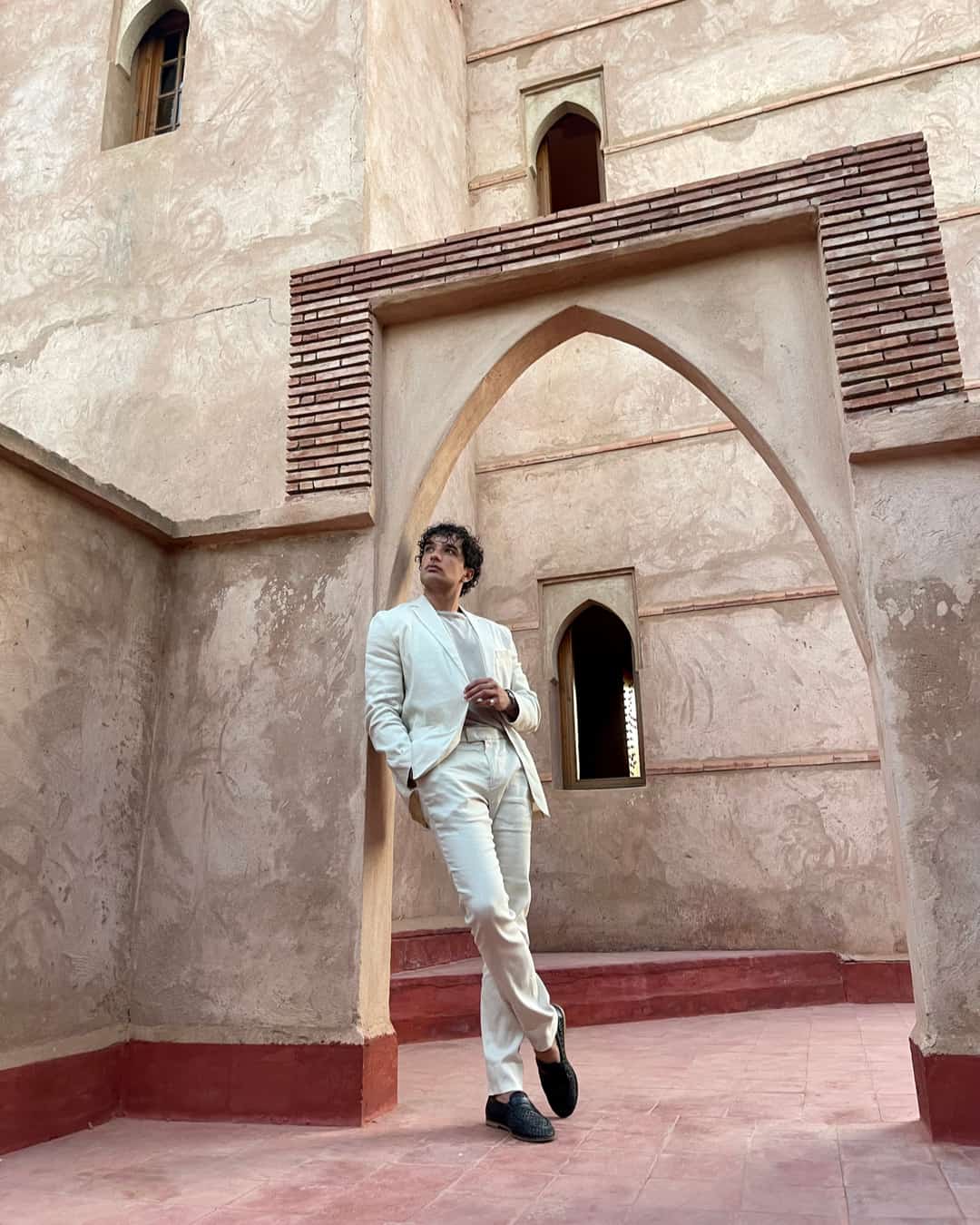 man wearing a linen blazer and trousers