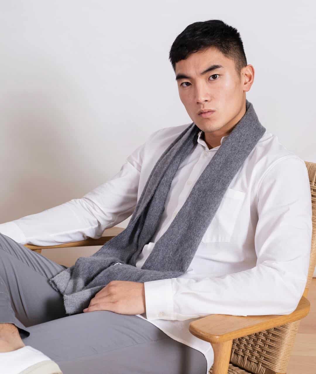 man wearing the cashmere city scarf by L'Estrange